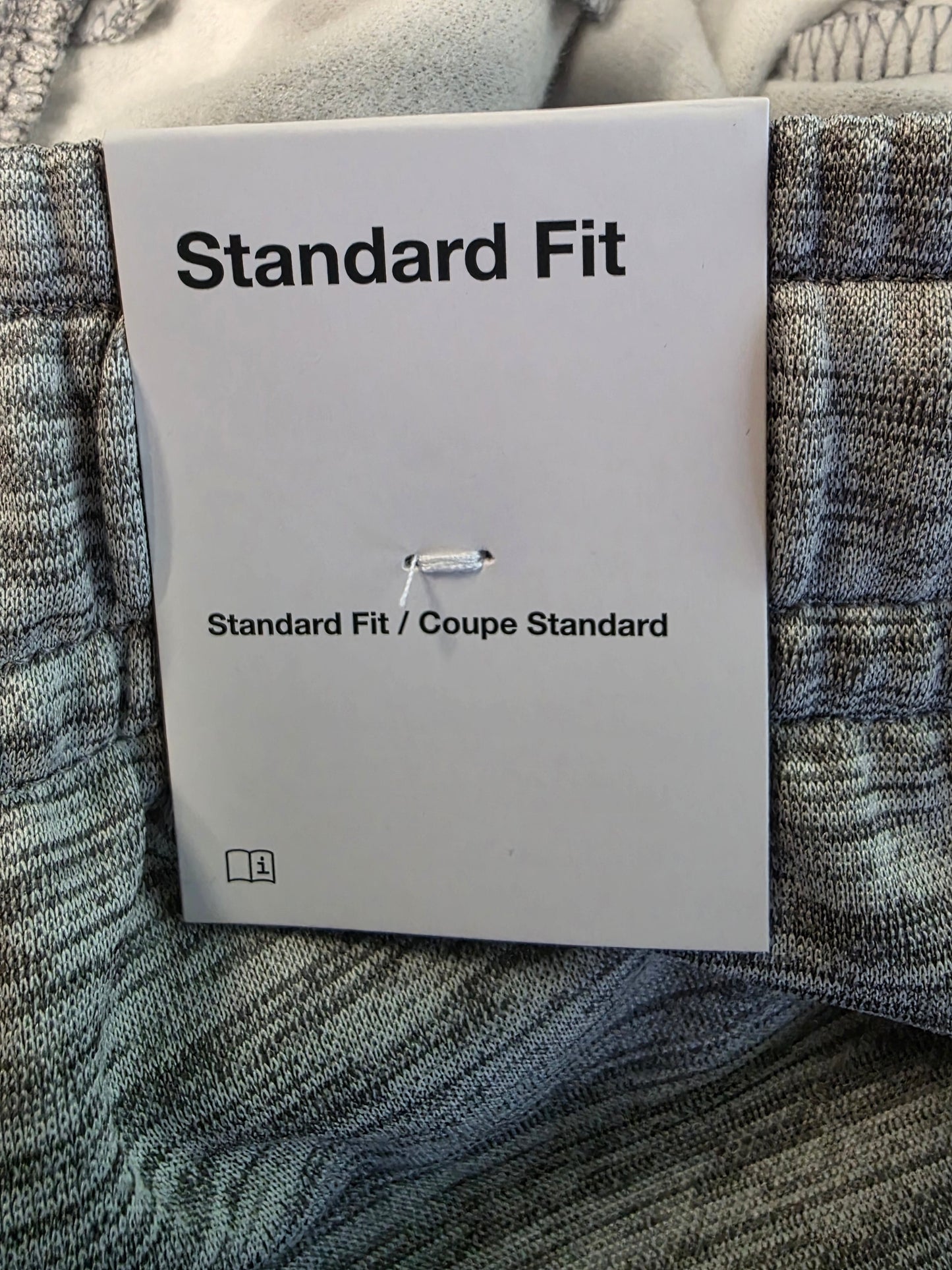 Label with 'Standard Fit' text on a textured fabric background