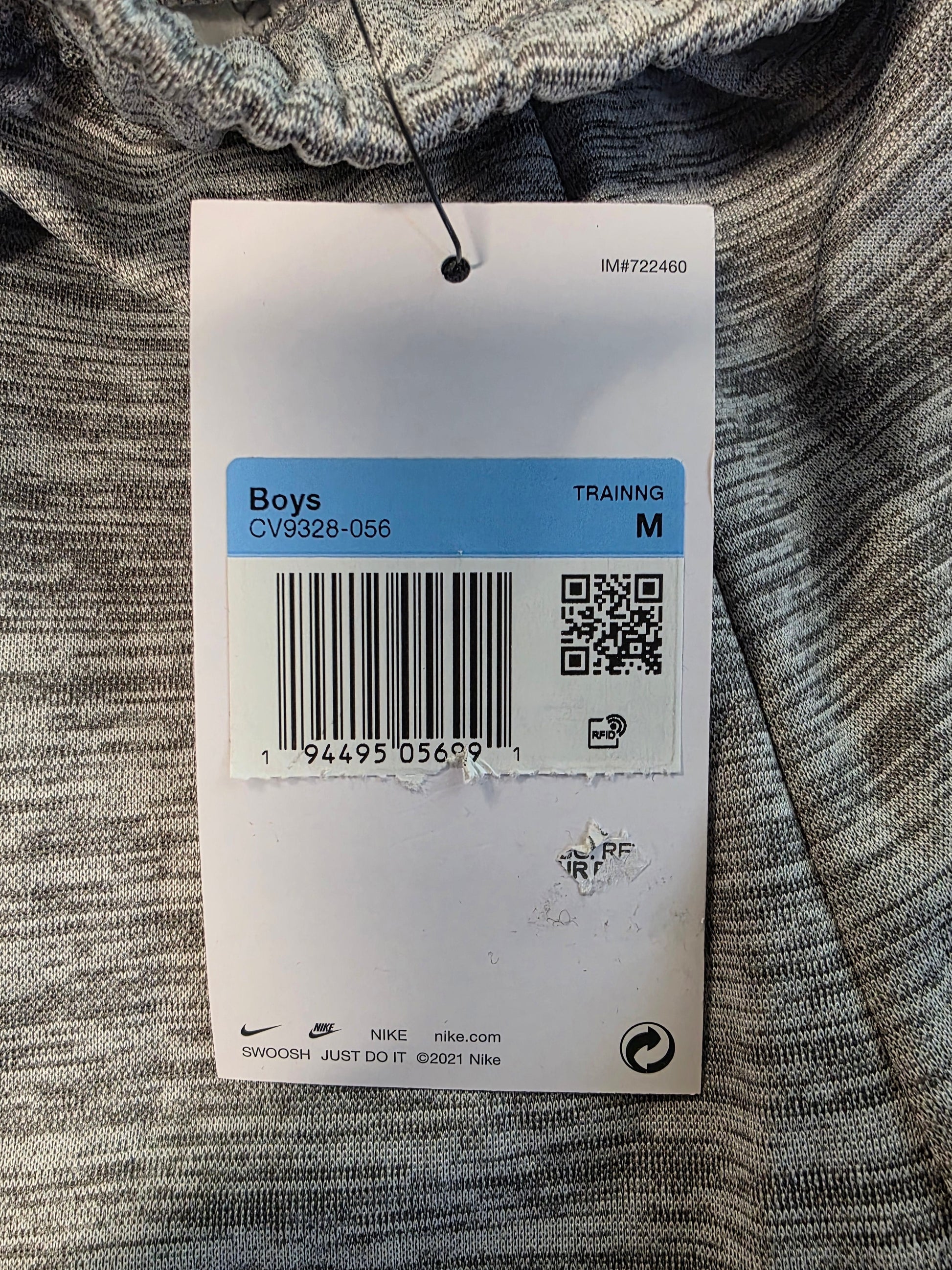 Clothing tag on a textured fabric background
